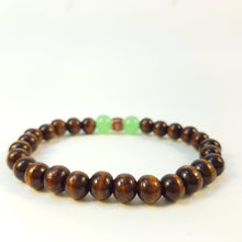 Load image into Gallery viewer, Dark Brown Wood Bracelet with Green Bead Accent
