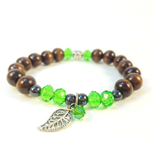 Load image into Gallery viewer, Dark Brown Wood Bracelet with Green Bead accent and Leaf
