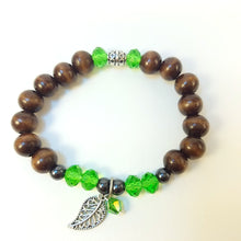 Load image into Gallery viewer, Dark Brown Wood Bracelet with Green Bead accent and Leaf
