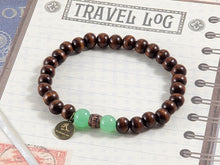 Load image into Gallery viewer, Dark Brown Wood Bracelet with Green Bead Accent
