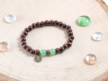 Load image into Gallery viewer, Dark Brown Wood Bracelet with Green Bead Accent
